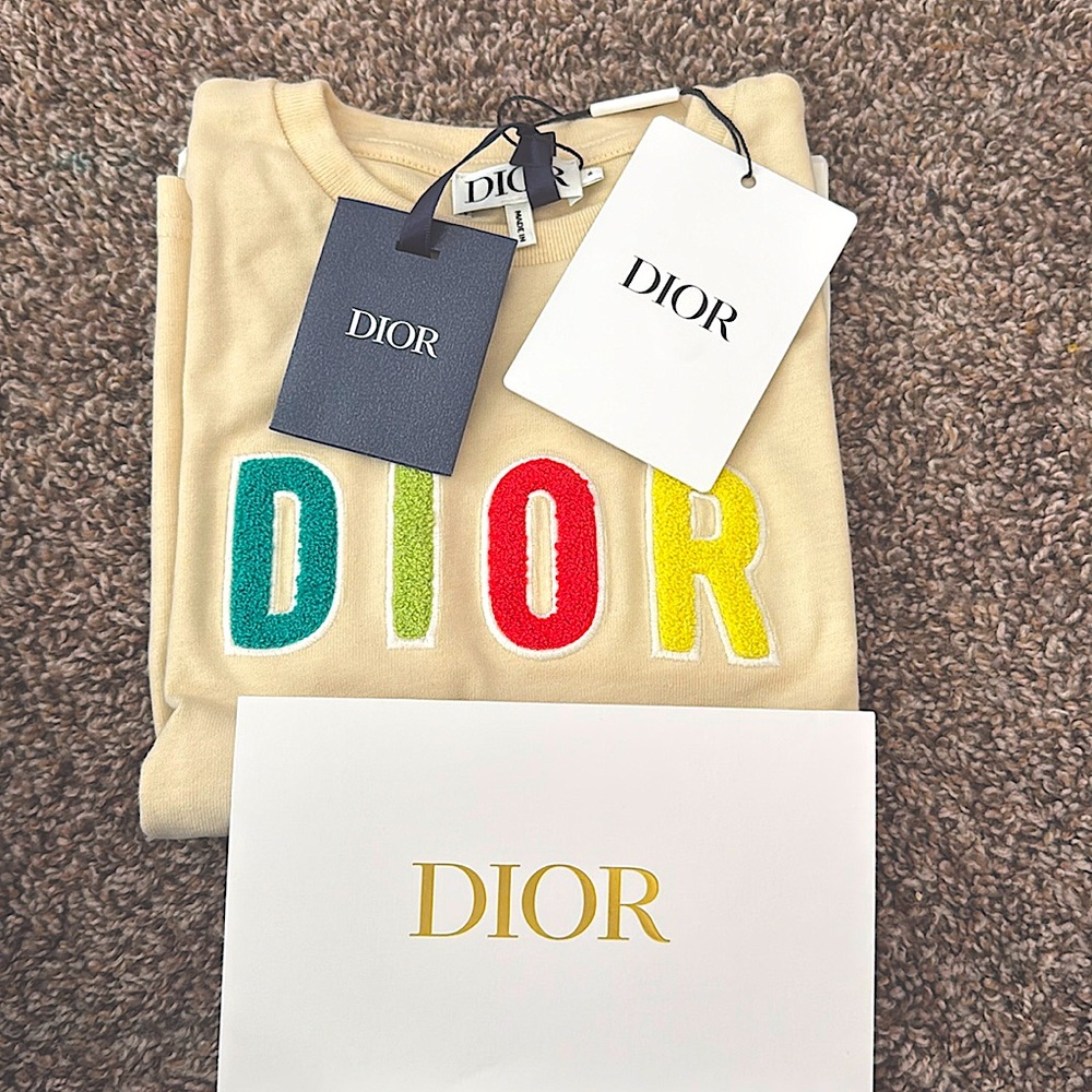 Cream and multicolored letters